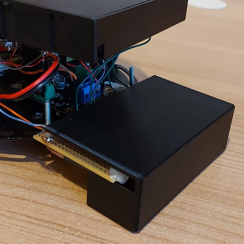 Image of the 3D printed shield sitting on the line detection module